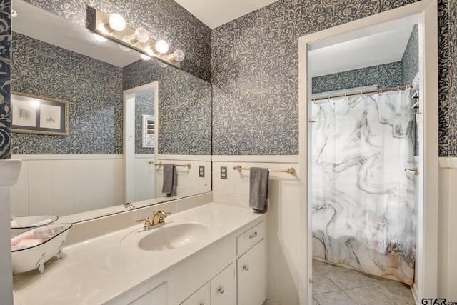 bathroom with vanity, walk in shower, and tile patterned flooring