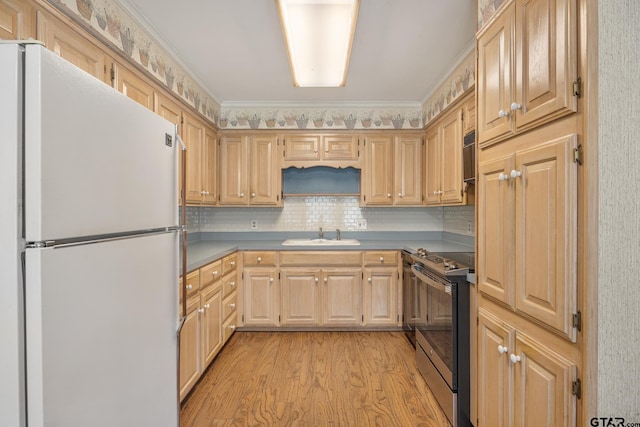 kitchen featuring white refrigerator, stainless steel range with electric cooktop, crown molding, light brown cabinets, and light wood-type flooring