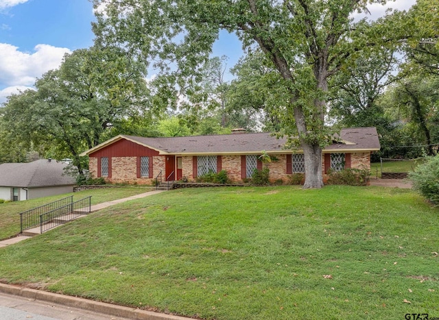 single story home with a front yard