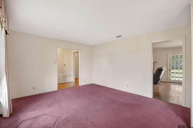 empty room with wood-type flooring