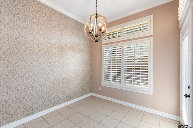 unfurnished room with a notable chandelier, light tile patterned flooring, and ornamental molding