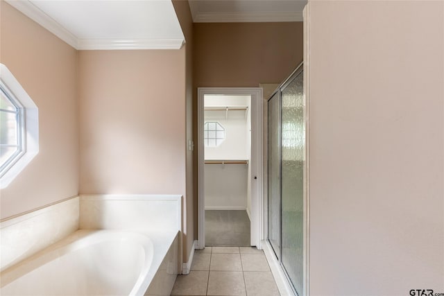 bathroom with plenty of natural light, shower with separate bathtub, crown molding, and tile patterned flooring