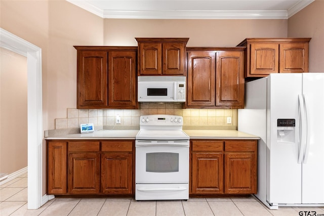 kitchen with tasteful backsplash, light tile patterned flooring, white appliances, and ornamental molding