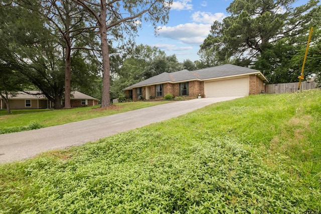 9331 Londonderry Dr, Tyler, TX 75703 - ranch-style home with an attached garage, driveway, and brick siding