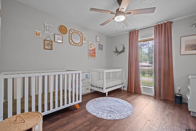 9331 Londonderry Dr, Tyler, TX 75703 - bedroom with a textured ceiling, wood finished floors, and a ceiling fan