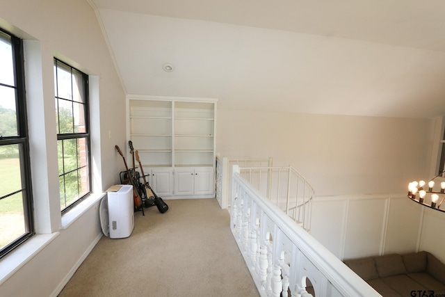 18751 Ridgeline, Tyler, TX 75703 - corridor with light colored carpet, an upstairs landing, and a chandelier