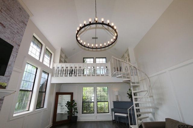 18751 Ridgeline, Tyler, TX 75703 - stairs featuring high vaulted ceiling, a chandelier, plenty of natural light, and wood finished floors