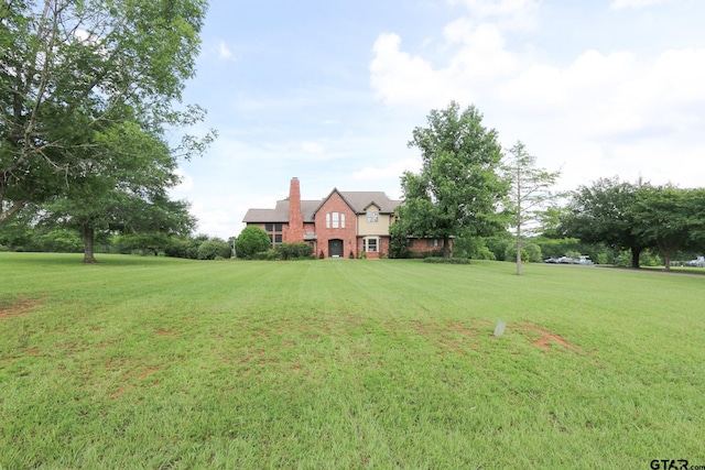 18751 Ridgeline, Tyler, TX 75703 - view of front of home featuring a front yard and a chimney