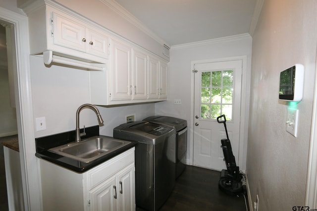 18751 Ridgeline, Tyler, TX 75703 - laundry room with washing machine and clothes dryer, cabinet space, dark wood-style flooring, and ornamental molding