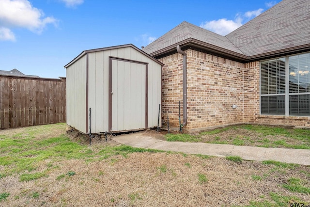 view of shed with fence