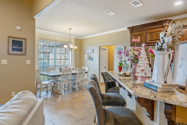 dining space with visible vents, a chandelier, crown molding, and light tile patterned flooring