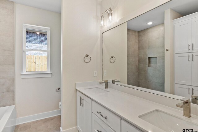 full bathroom with separate shower and tub, vanity, tile patterned floors, and toilet