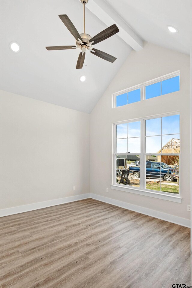 bonus room with a wealth of natural light, light hardwood / wood-style flooring, high vaulted ceiling, and beam ceiling