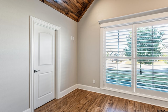 spare room featuring hardwood / wood-style flooring, vaulted ceiling, and wooden ceiling