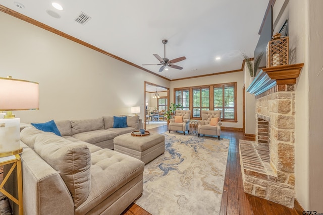 7216 Princedale, Tyler, TX 75703 - living room featuring wood finished floors, ornamental molding, a ceiling fan, a stone fireplace, and recessed lighting