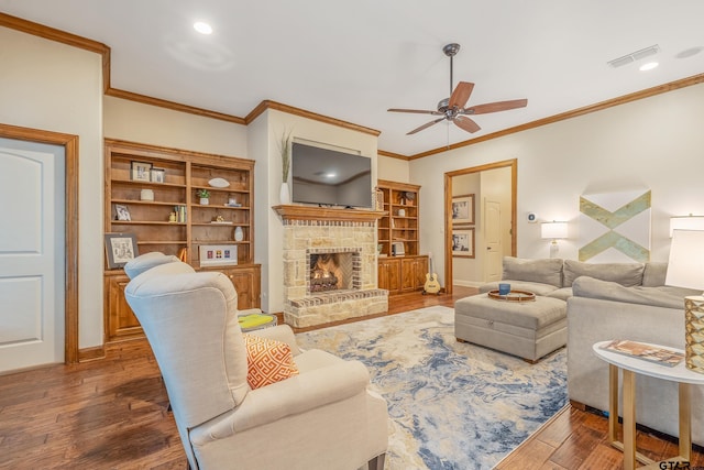 7216 Princedale, Tyler, TX 75703 - living area featuring a ceiling fan, wood finished floors, a fireplace, crown molding, and recessed lighting