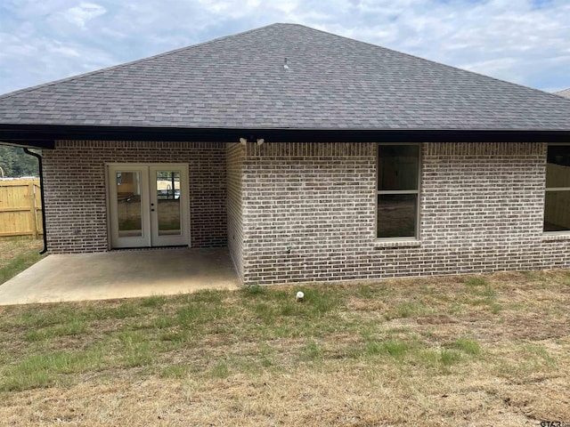 rear view of house with a patio area and french doors