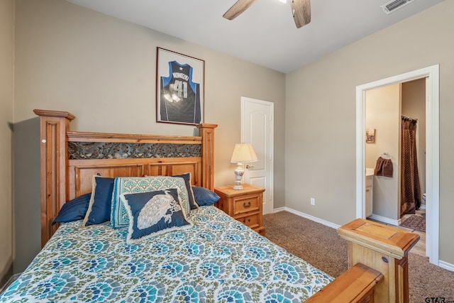 18050 Deer Trl, Flint, TX 75762 - carpeted bedroom featuring ceiling fan, baseboards, visible vents, and ensuite bath