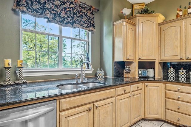 18050 Deer Trl, Flint, TX 75762 - kitchen featuring light tile patterned floors, dishwasher, light brown cabinets, a sink, and dark stone counters