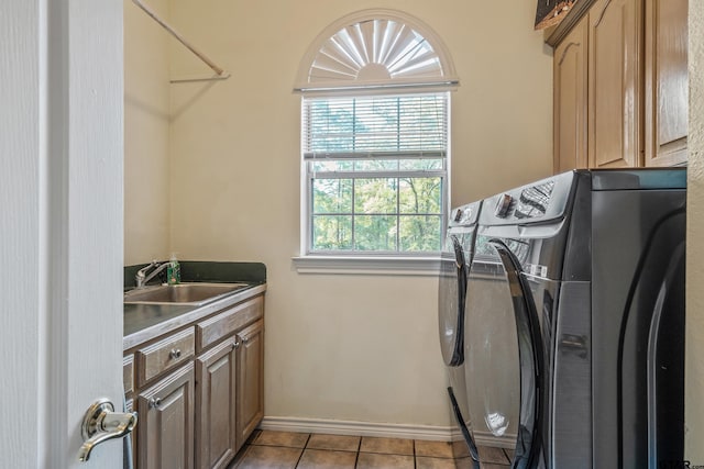 18050 Deer Trl, Flint, TX 75762 - laundry room featuring baseboards, light tile patterned flooring, cabinet space, washer and dryer, and a sink