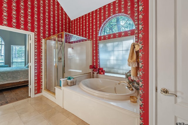 18050 Deer Trl, Flint, TX 75762 - ensuite bathroom featuring ensuite bathroom, a bath, a shower stall, wallpapered walls, and tile patterned floors