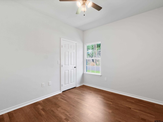 empty room featuring hardwood / wood-style floors and ceiling fan