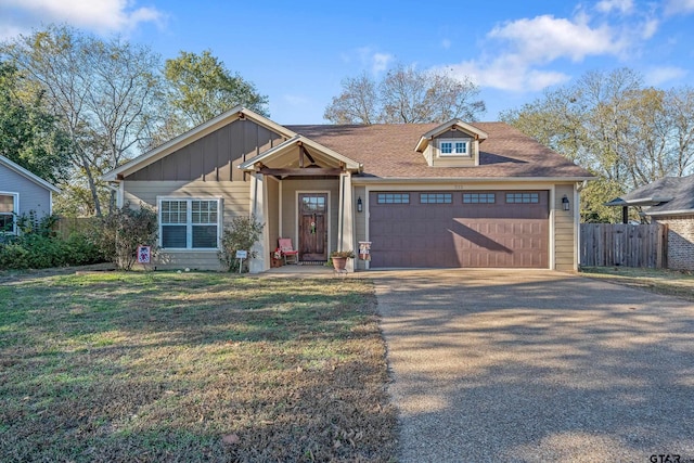 view of front facade featuring a garage and a front lawn