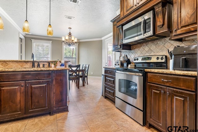 kitchen with light stone counters, tasteful backsplash, a chandelier, stainless steel appliances, and ornamental molding