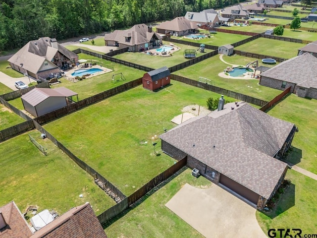 birds eye view of property with a residential view