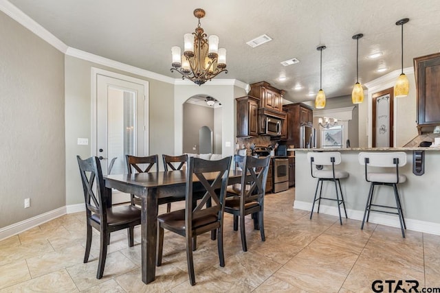 dining space with visible vents, ornamental molding, arched walkways, baseboards, and a chandelier