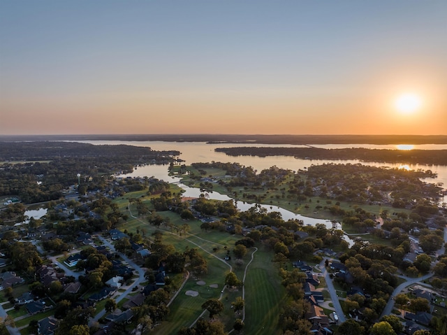 aerial view at dusk with a water view