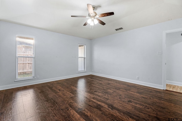 unfurnished room with dark hardwood / wood-style floors and ceiling fan