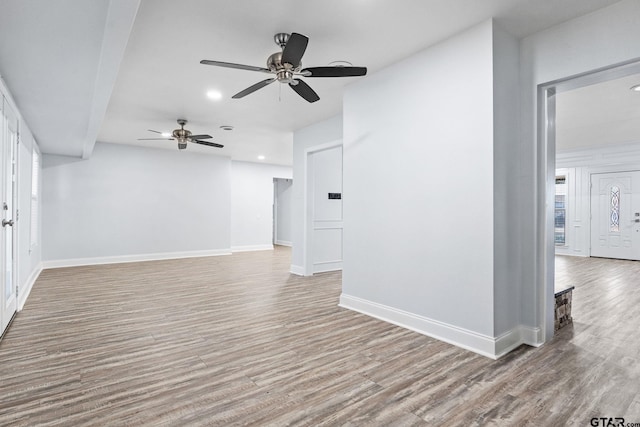 unfurnished room featuring light hardwood / wood-style flooring and ceiling fan