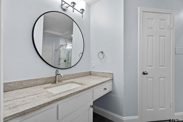 bathroom with tile patterned floors, vanity, and a shower