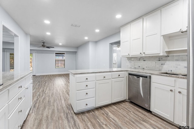 kitchen featuring white cabinets, dishwasher, a healthy amount of sunlight, and light hardwood / wood-style flooring