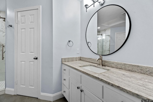 bathroom with tile patterned floors, vanity, and an enclosed shower