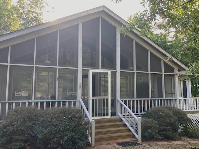 view of side of home with a sunroom