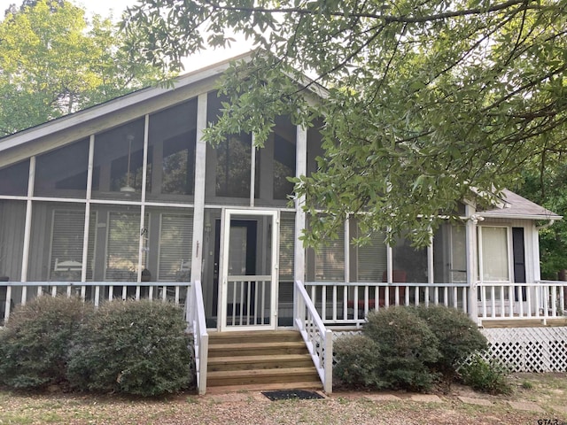 371 Wildwood Trl, Holly Lake Ranch, TX 75765 - view of front facade with a sunroom