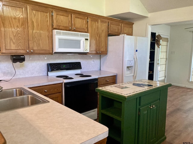 371 Wildwood Trl, Holly Lake Ranch, TX 75765 - kitchen featuring white appliances, a sink, light countertops, and green cabinetry