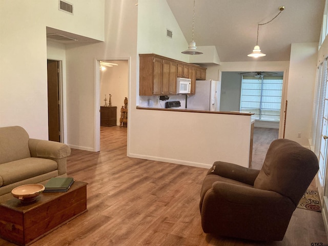 371 Wildwood Trl, Holly Lake Ranch, TX 75765 - living area featuring ceiling fan, high vaulted ceiling, light wood-style floors, and baseboards