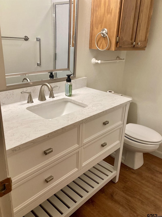 371 Wildwood Trl, Holly Lake Ranch, TX 75765 - bathroom with vanity, wood finished floors, and toilet