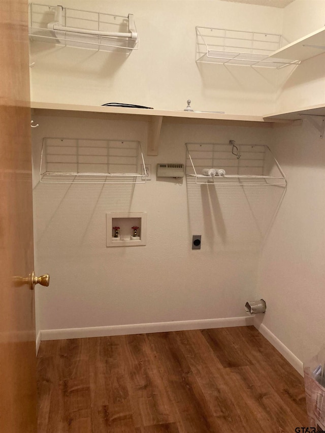 laundry room featuring hookup for an electric dryer, washer hookup, and hardwood / wood-style flooring