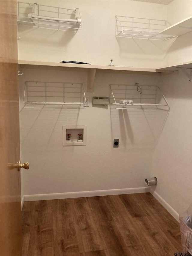 371 Wildwood Trl, Holly Lake Ranch, TX 75765 - laundry area featuring wood finished floors, washer hookup, baseboards, and electric dryer hookup
