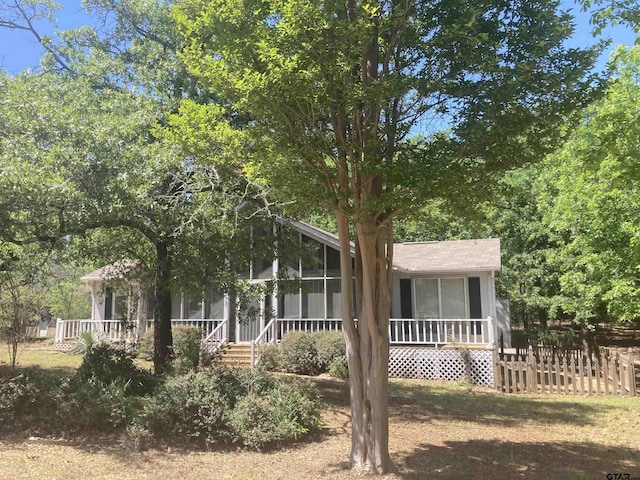 371 Wildwood Trl, Holly Lake Ranch, TX 75765 - view of front facade featuring a sunroom