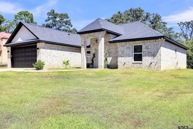 french provincial home featuring a front lawn, brick siding, roof with shingles, and a garage