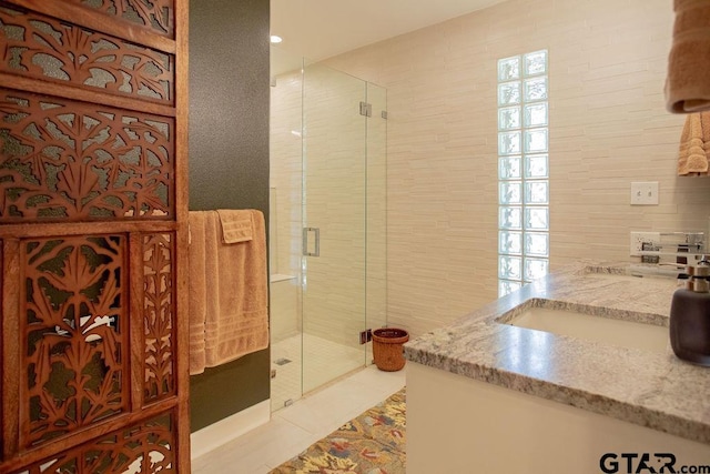 225 Texas Dr, Hideaway, TX 75771 - bathroom featuring a stall shower, tile patterned floors, and vanity