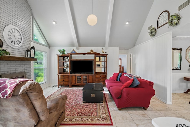 tiled living area featuring a fireplace, beam ceiling, high vaulted ceiling, and visible vents
