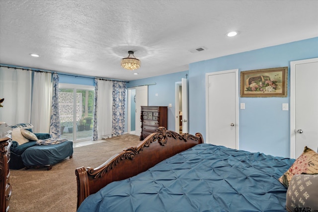 carpeted bedroom with recessed lighting, a textured ceiling, visible vents, and access to exterior