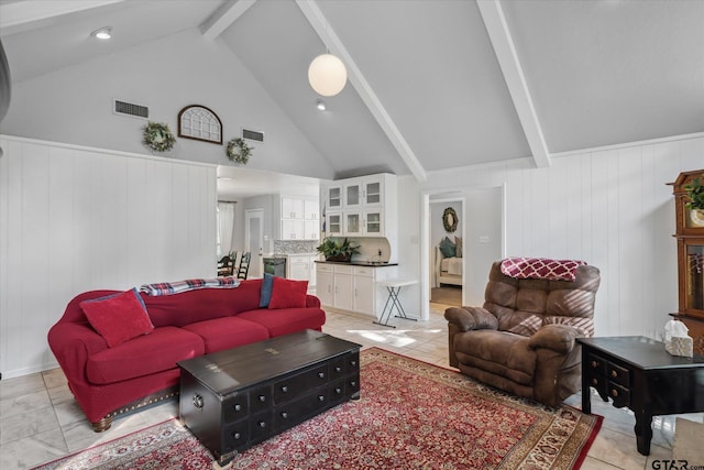 living area featuring high vaulted ceiling, beam ceiling, and visible vents