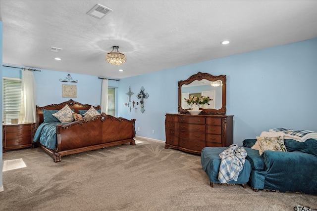 carpeted bedroom with recessed lighting, visible vents, and baseboards